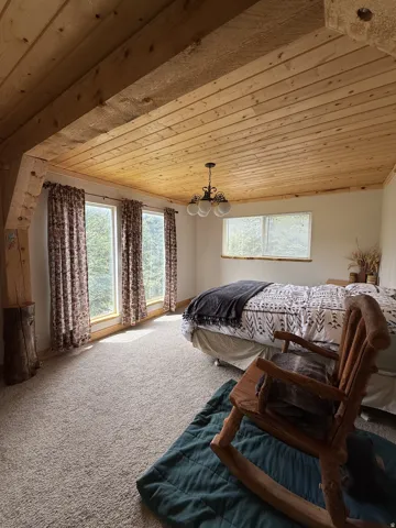 Wood-paneled ceiling with exposed beams