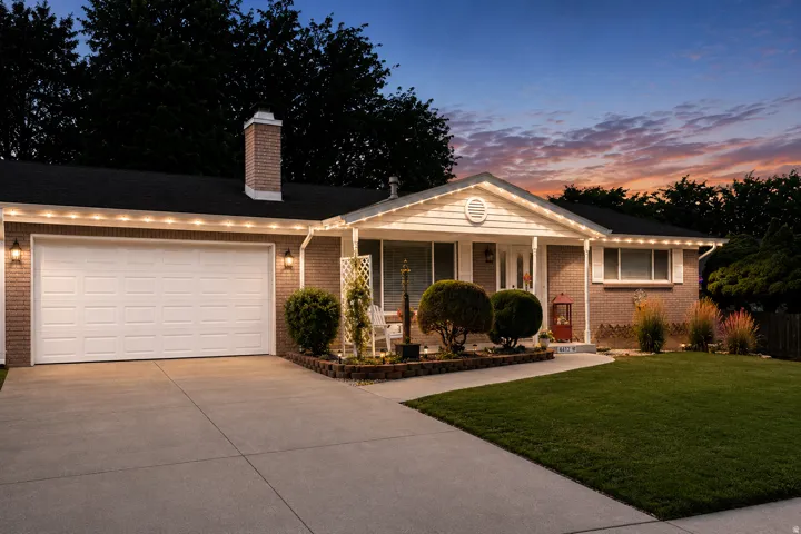 Brick exterior with white garage door and matching trim