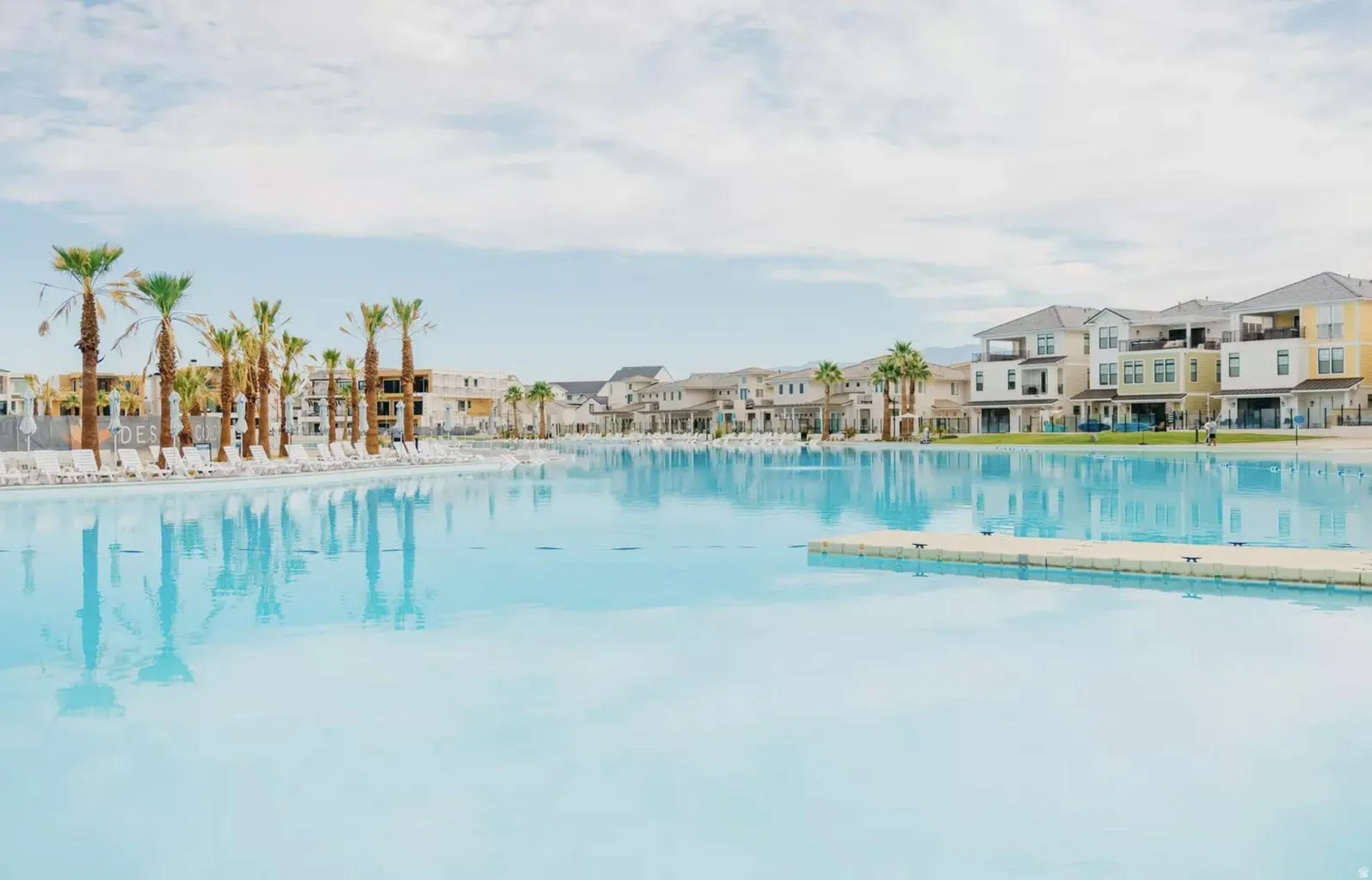 Expansive artificial lagoon surrounded by multi-story residential structures