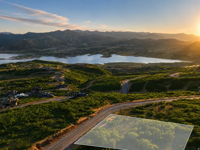 Expansive mountain and lake scenery framing a residential development