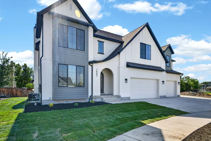 Modern exterior with white brick and gray siding accents