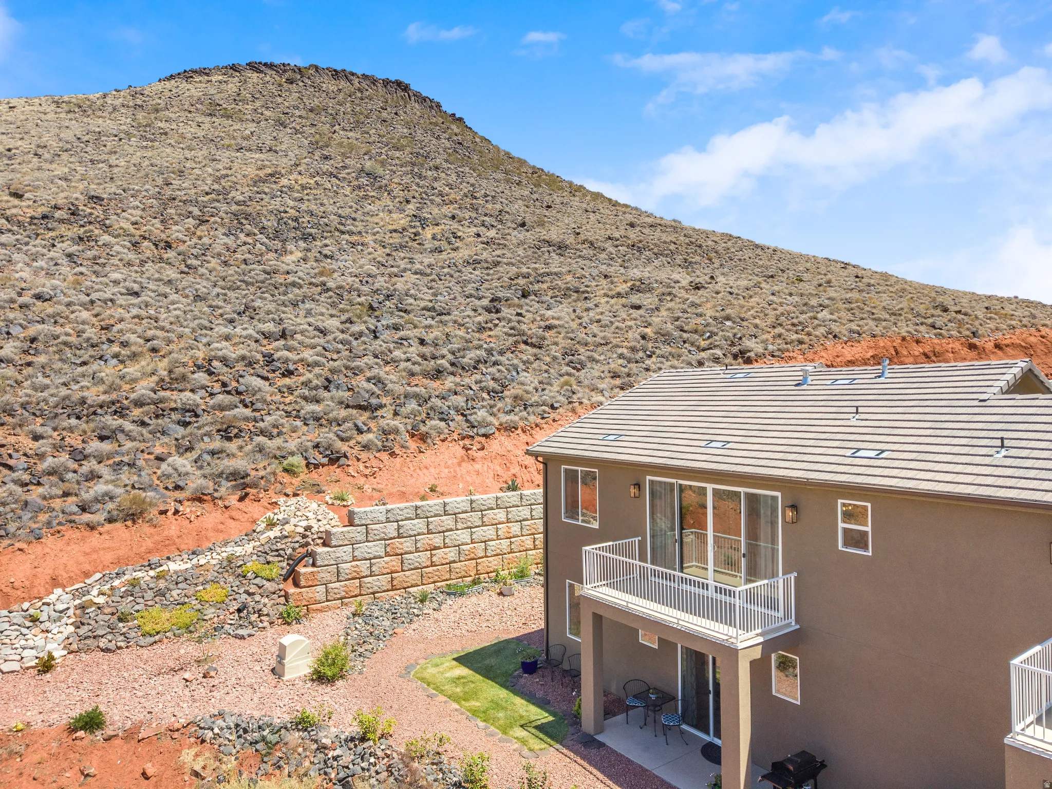 Contemporary stucco exterior with a tiled roof