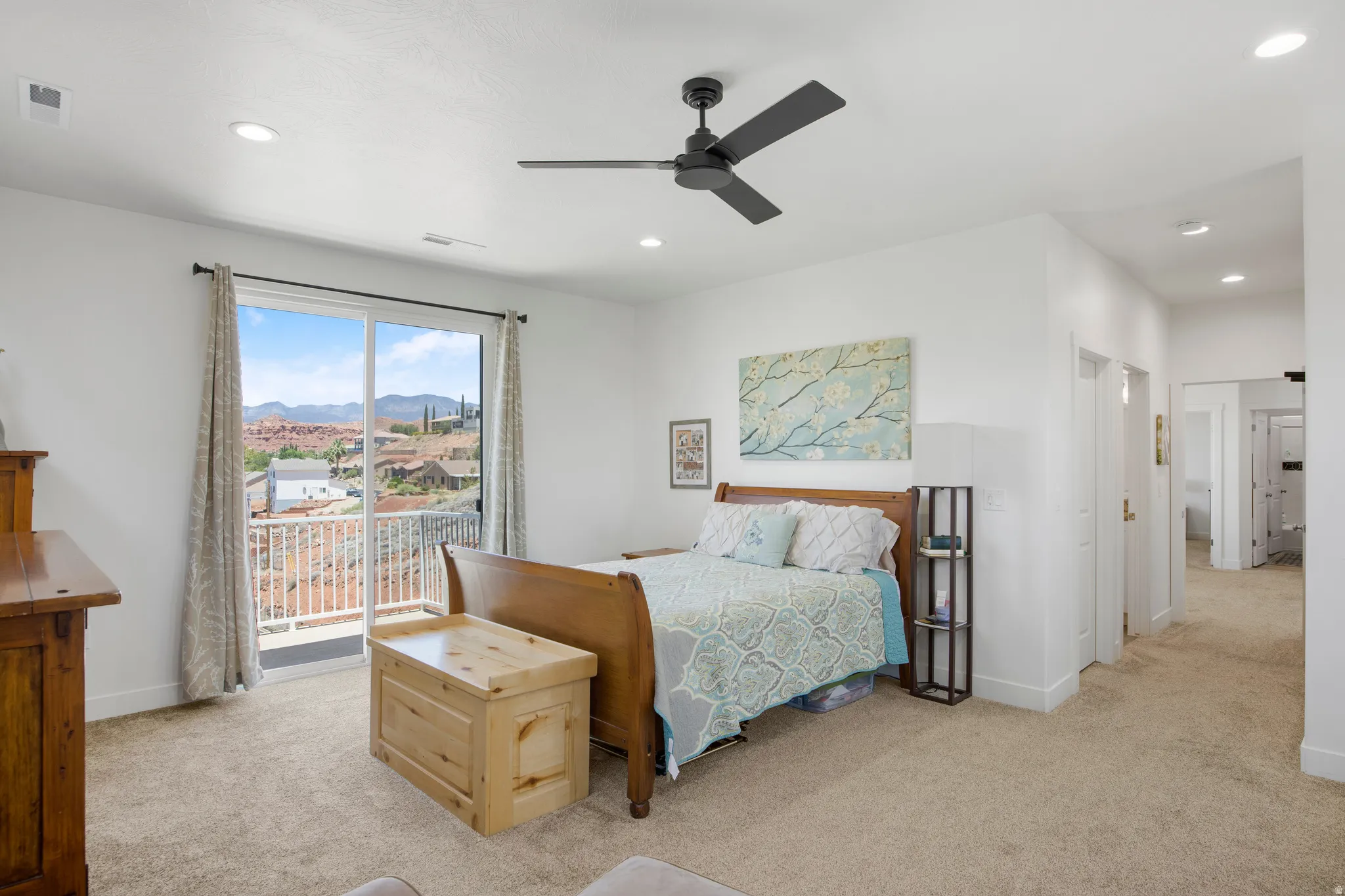 Bedroom featuring direct access to an outdoor balcony through a sliding glass door
