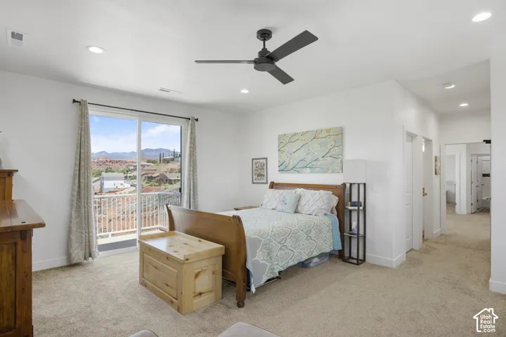 Bedroom featuring direct access to an outdoor balcony through a sliding glass door