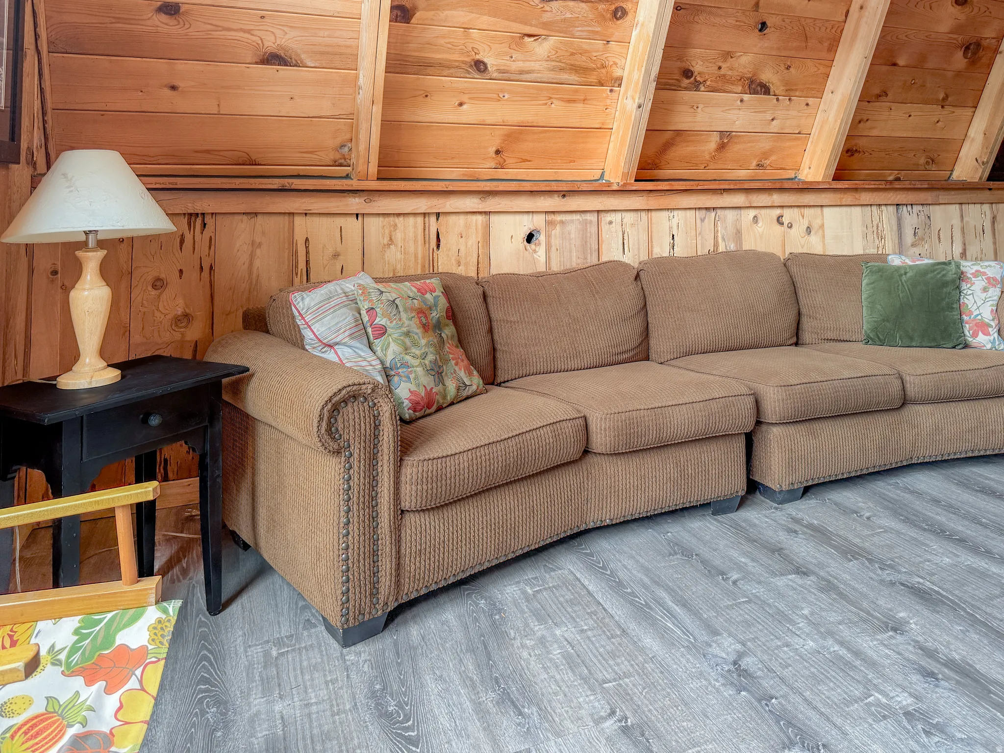 Wood-paneled wall details, with exposed wood ceiling beams