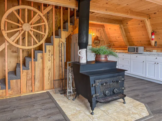 Cast iron wood-burning stove with a tiled hearth