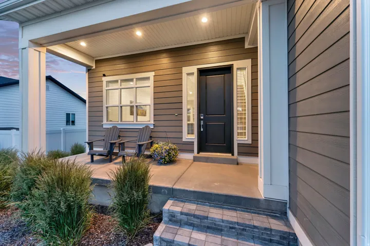 Inviting covered front porch with recessed lighting