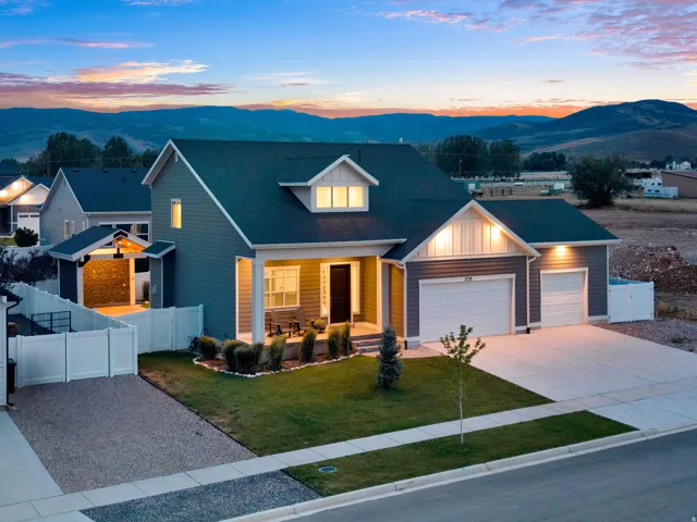 Contemporary residence with a dark gray exterior siding and white trim