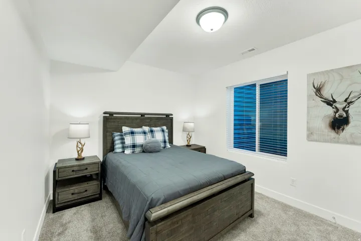Bright room with a recessed ceiling light and a window featuring horizontal blinds