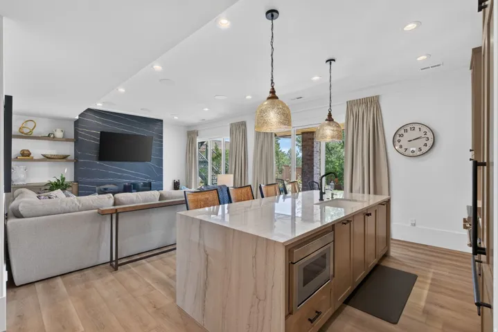 Guest House Spacious open-concept interior featuring light wood-finish flooring