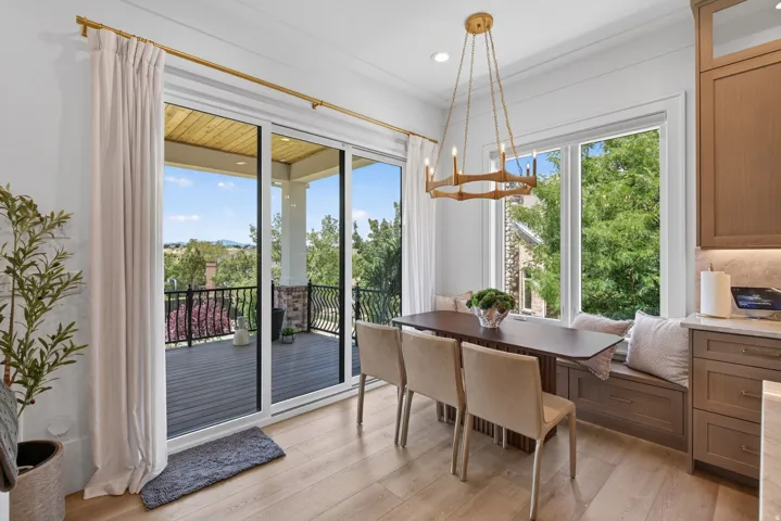 Guest House Wood-finish flooring throughout, featuring a built-in window seat, a contemporary chandelier, and a spacious outdoor balcony with decorative railing