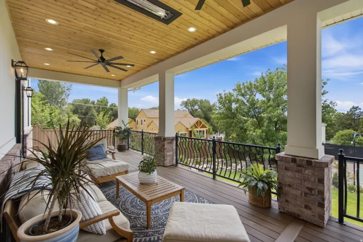 Guest House Covered outdoor living space featuring a wood-panel ceiling, recessed lighting, and a ceiling fan