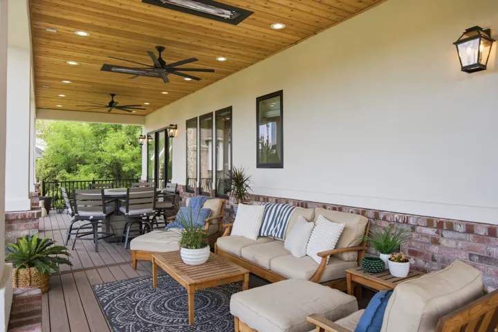 Guest House Covered patio featuring a wood-finish plank ceiling, recessed lighting, and dual ceiling fans