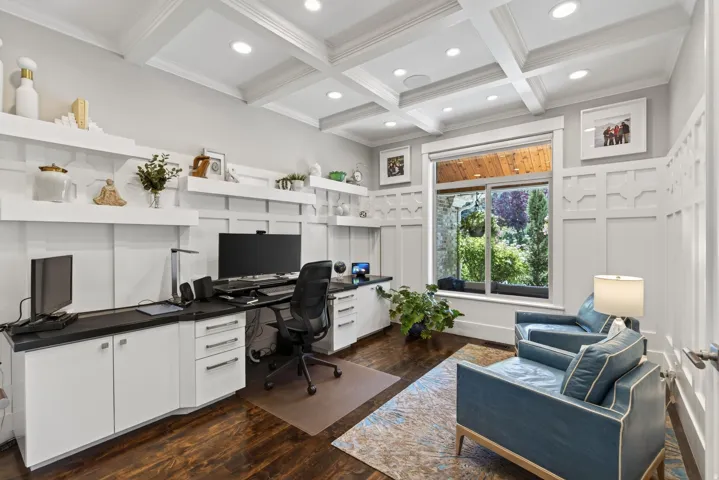 Custom built-in desk and cabinetry with dark countertops
