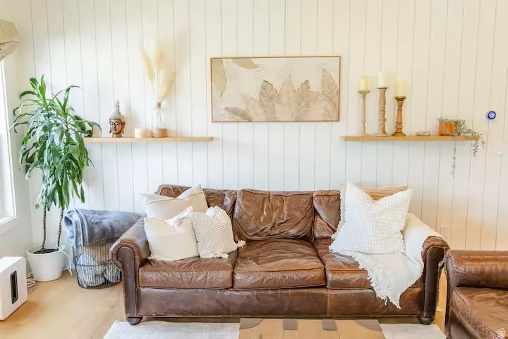 Vertical shiplap accent wall with light wood-finish flooring