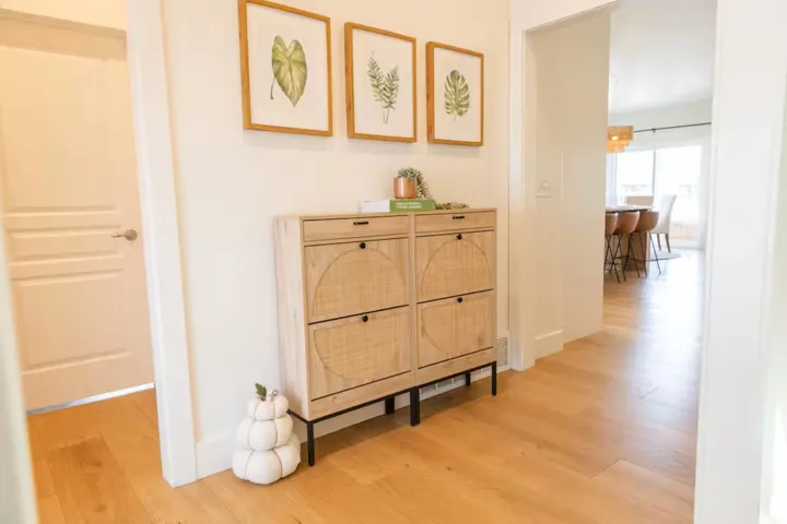 Light wood-finish flooring extending through an open-concept interior