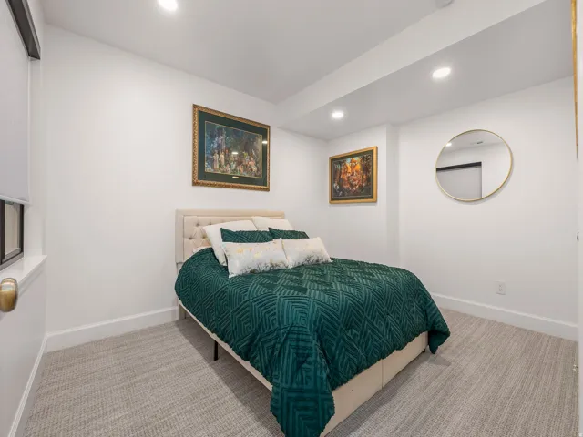 White painted walls with recessed lighting and crown molding