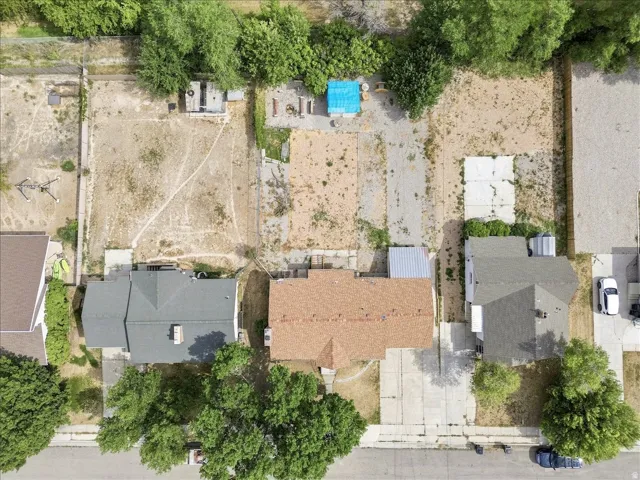 Expansive property featuring a large, undeveloped lot with concrete pads