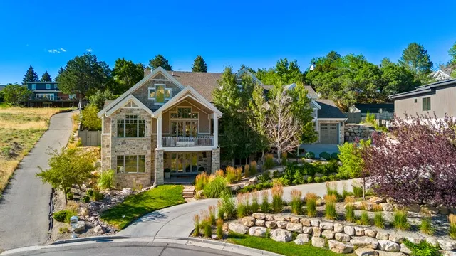 Stone and siding exterior with gabled roof lines