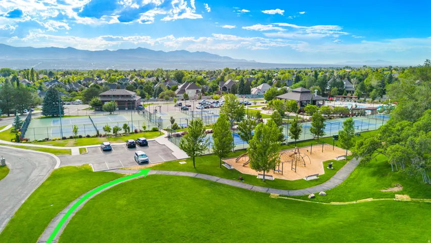 Walking/Biking Path that runs along the home provides quick access to community amenities featuring multiple tennis courts, a playground area, a swimming pool complex, and surrounding green spaces with mature trees