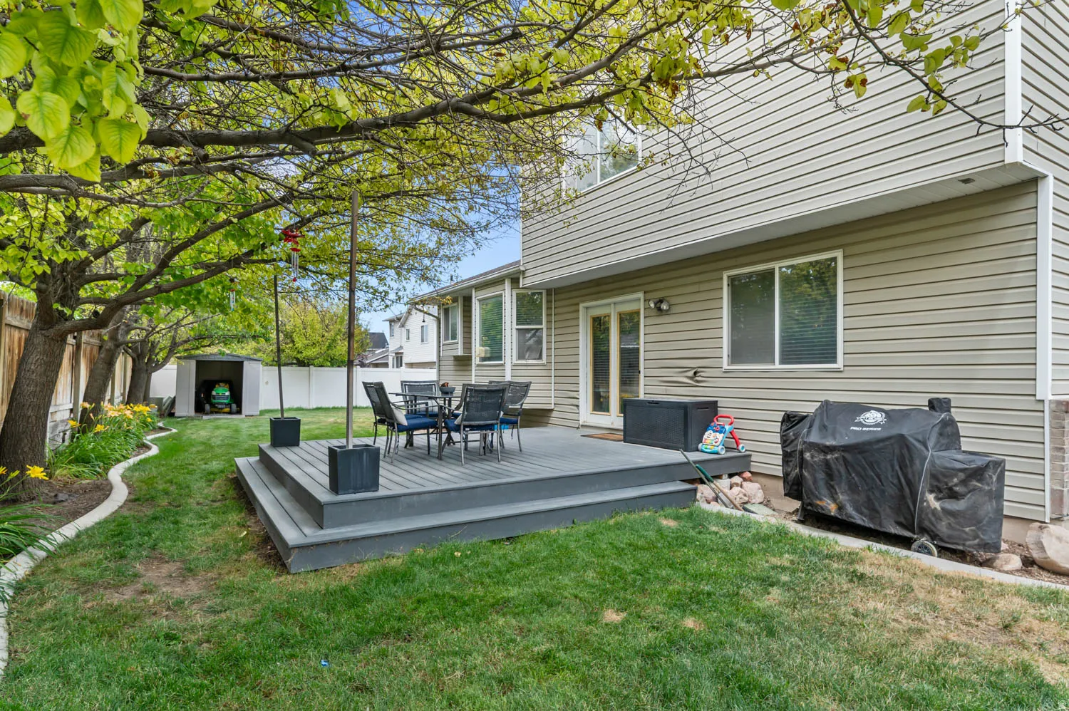 Expansive outdoor deck with multi-level design and direct access to the interior