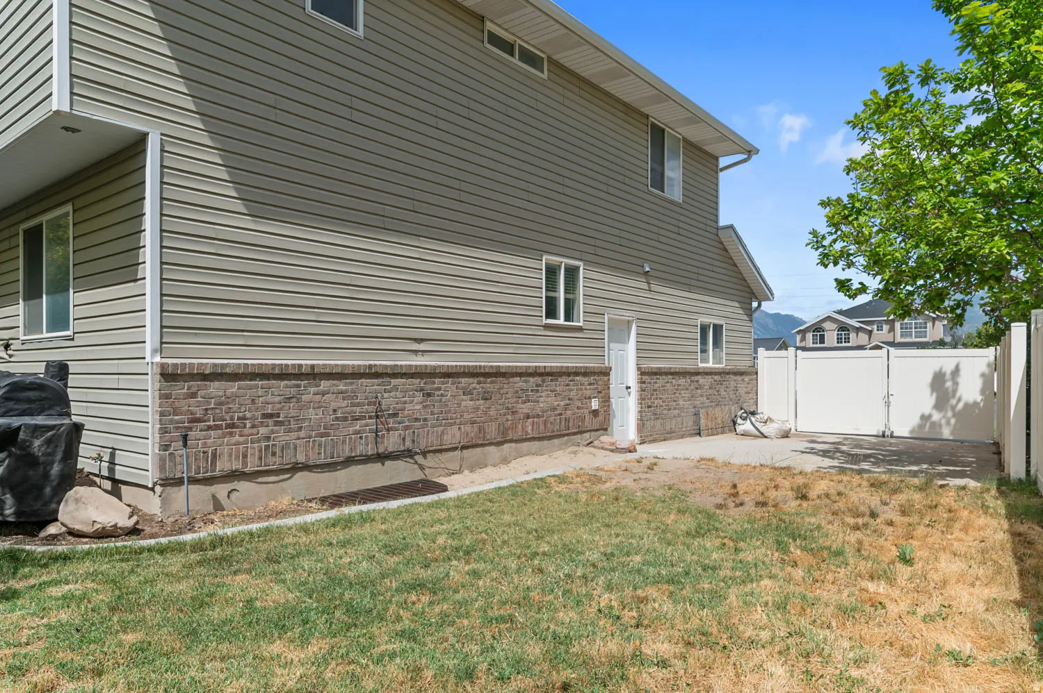 Exterior siding with a brick foundation accent