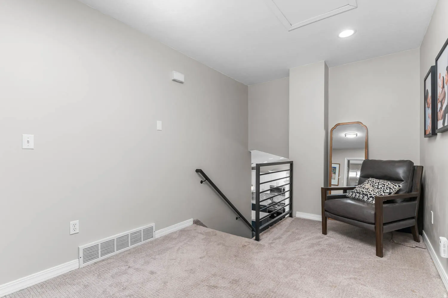Neutral-toned walls complement plush carpeting