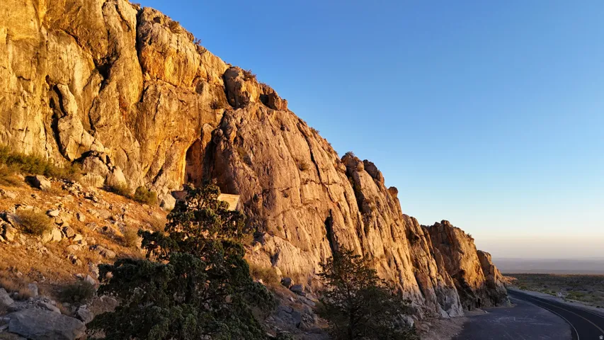 Rocky outcrop with natural rock formations and a desert landscape