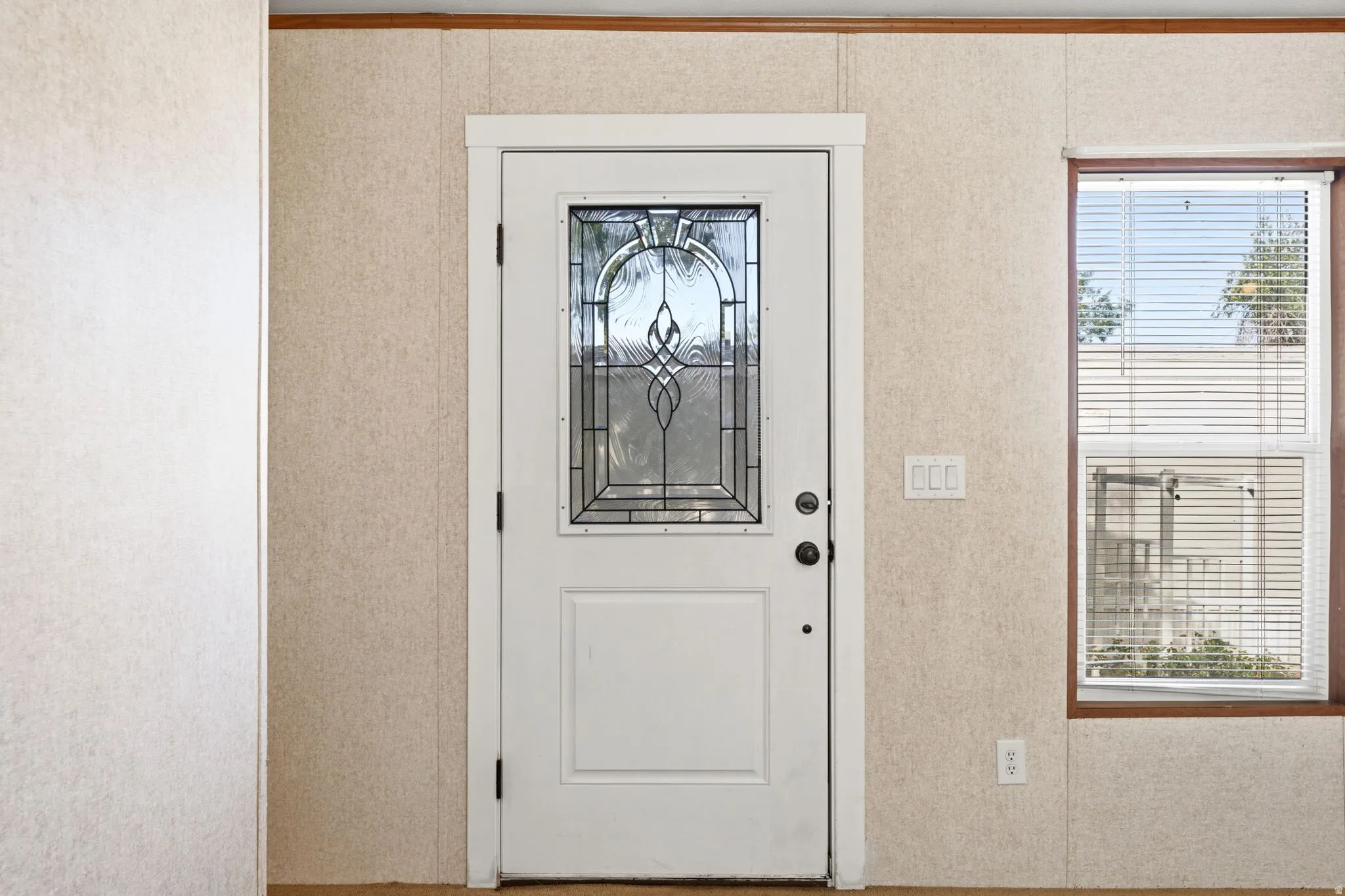 Entry door with decorative leaded glass paneling