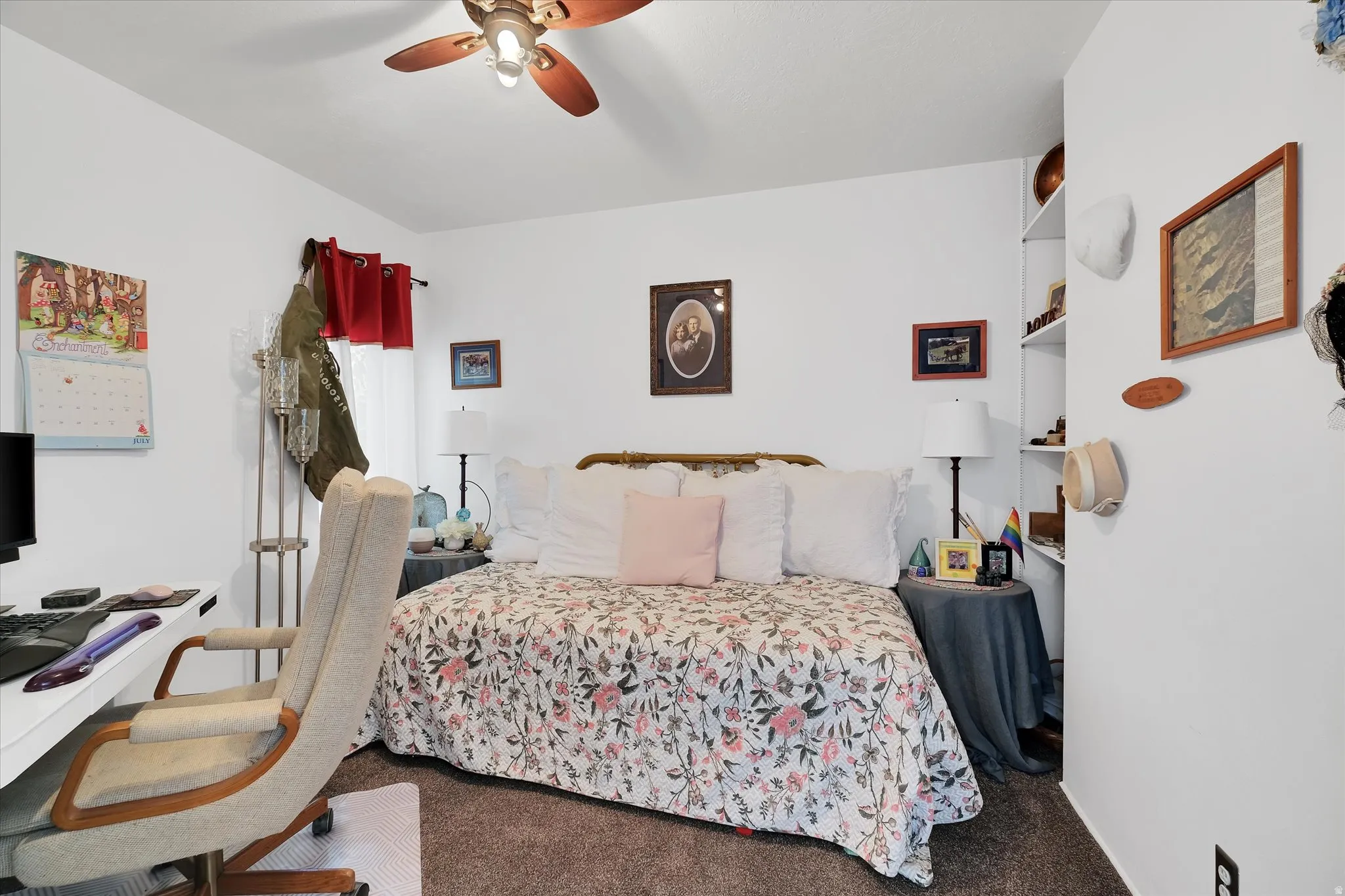 Bedroom featuring white walls and textured carpeting