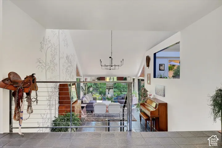 Split-level entry with slate tile flooring and a cable railing system