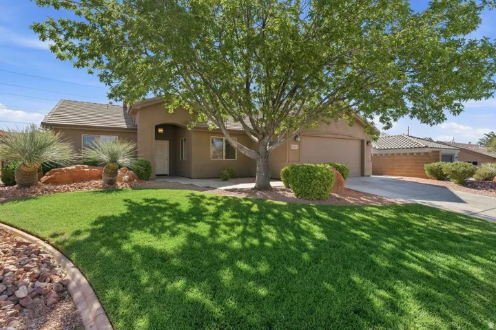 Contemporary stucco exterior with an arched entryway