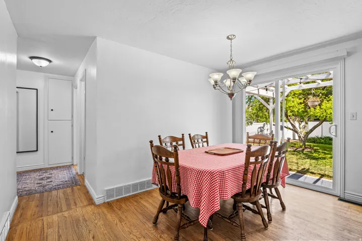 Hardwood flooring throughout dining area and hallway
