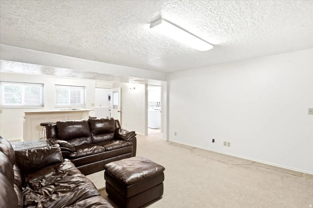Family room with view of laundry and walkout area.