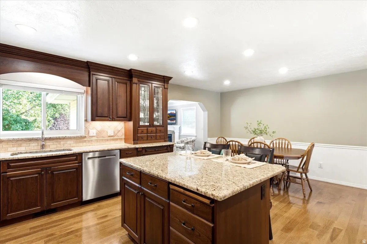 Open and bright, fully remodeled and expanded kitchen with hickory hardwood floors