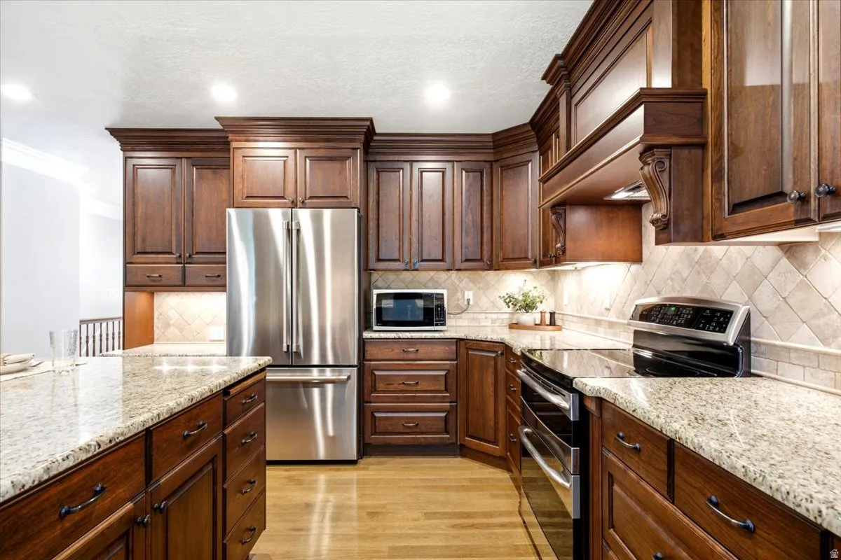 Beautiful cabinetry and granite countertops. Range hood vented to outside. Updated oven and dishwasher. Refrigerator is excluded