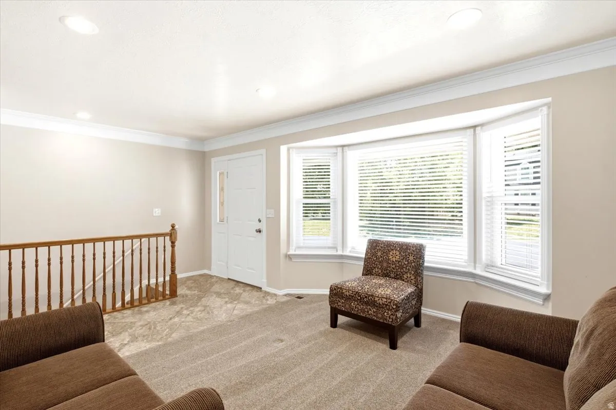 Formal living room with recessed lighting, and bay window. Entry was with convenient access to basement
