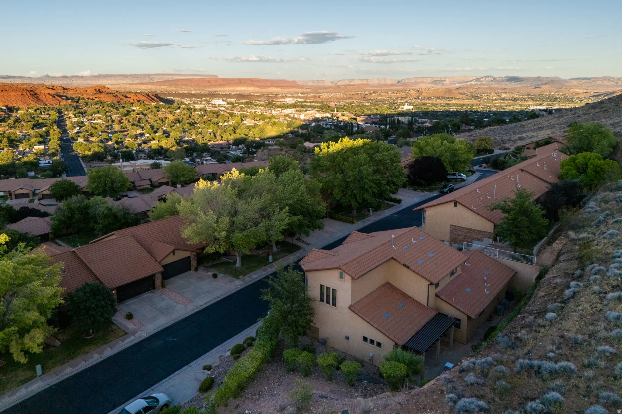 Terracotta roof tiles complement stucco exteriors across multiple properties