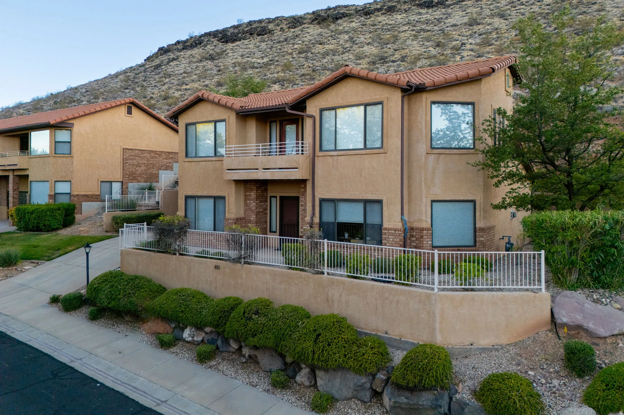 Stucco exterior with terracotta-style roof tiles