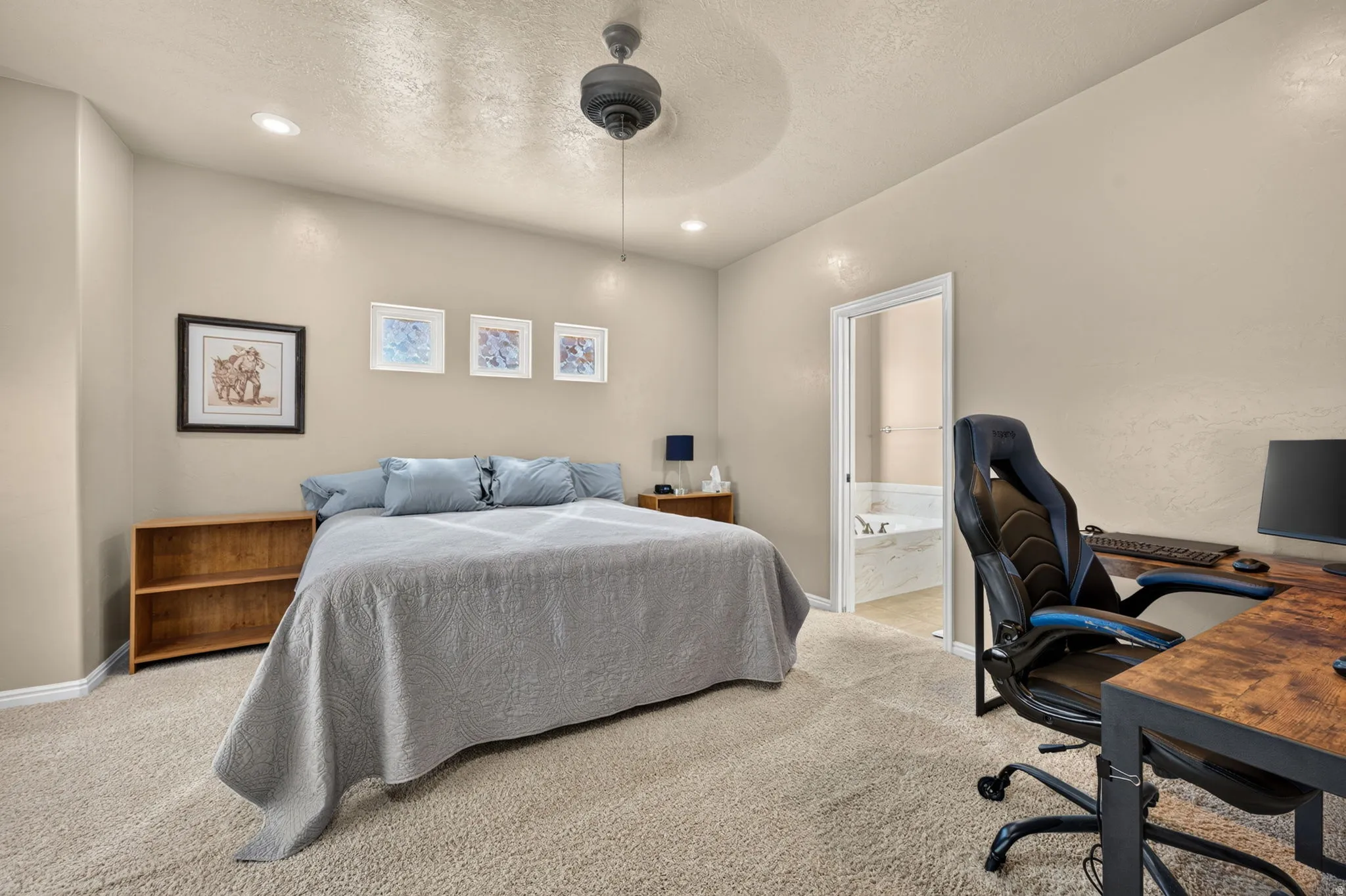 Neutral-toned bedroom featuring recessed lighting and a ceiling fan