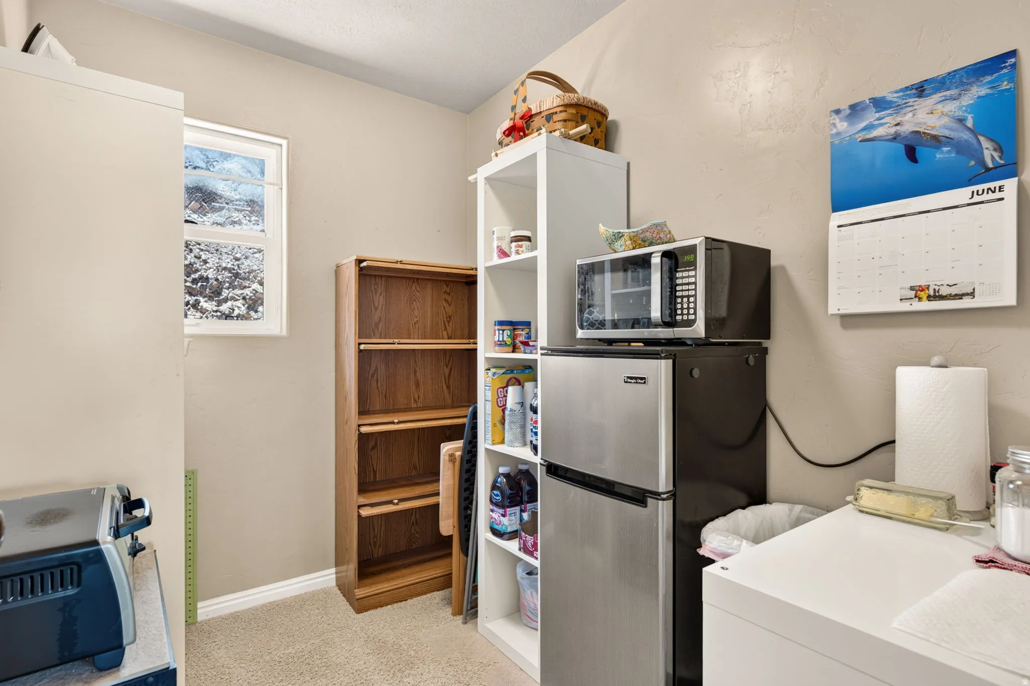 Neutral wall color with a window providing natural light