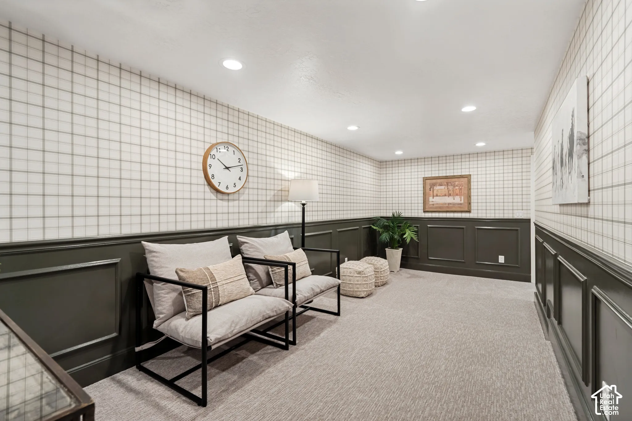 Finished room featuring wainscoting with a dark finish, plaid wallpaper, and recessed lighting