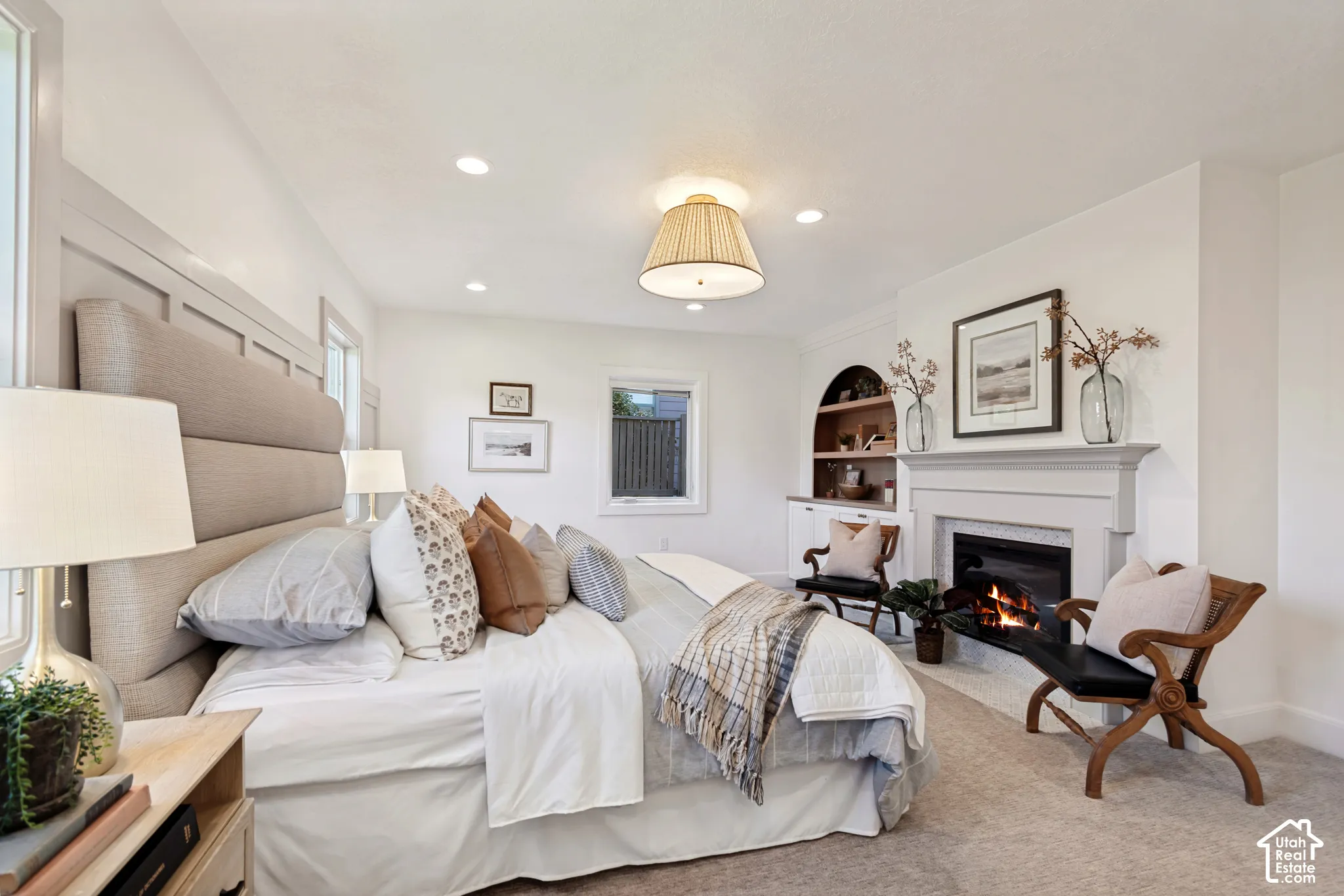 Spacious room featuring recessed lighting, a central ceiling fixture, and light-toned carpeting