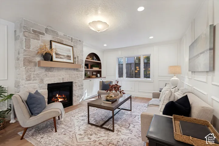 Stone-clad fireplace with a wood mantel