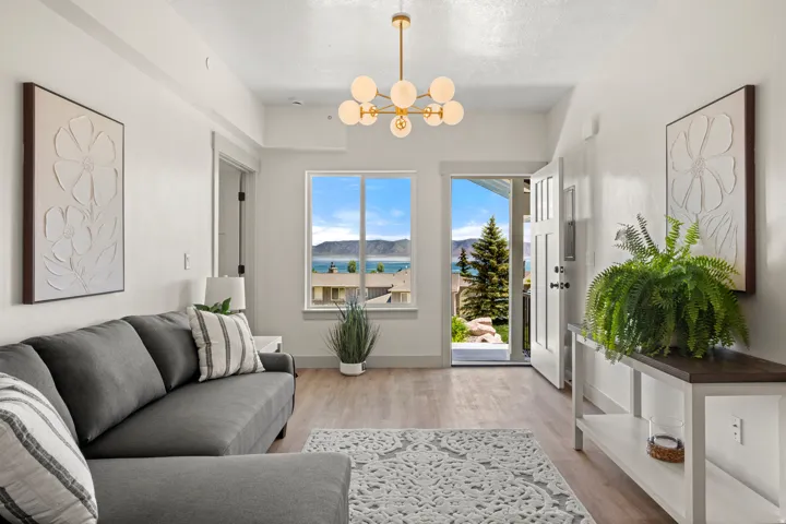 Entryway featuring wood-finish flooring and a contemporary chandelier