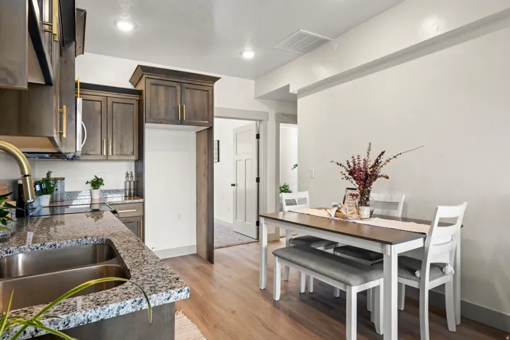 Kitchen and dining area featuring wood-finish flooring