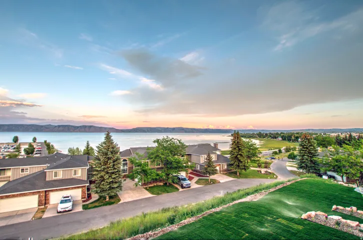 Expansive lakefront properties with mountain backdrop