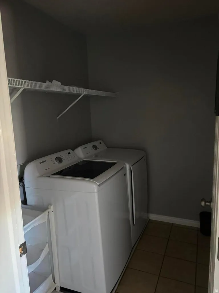 Dedicated laundry area featuring ceramic tile flooring