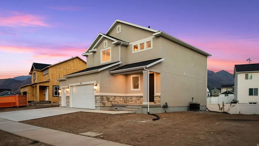 Contemporary two-story residence with stucco siding and stone detailing