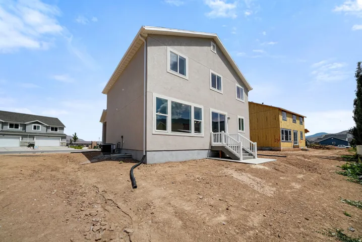 Contemporary two-story residence with a light-colored stucco exterior